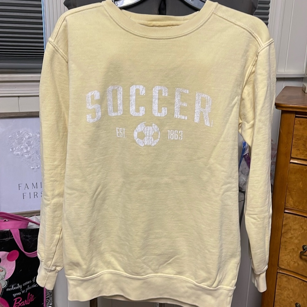 Comfort Colors Women’s Size Small pale yellow “soccer” sweatshirt